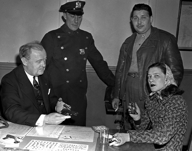Mob Moll, 1942: She pleads the fifth! Mob moll Smitty White was arrested and held at police headquarters in 1942 after her boyfriend Ralph Prisco was shot and killed by police during a failed holdup. Mob molls are also known as gun molls, or even gangster molls. The term moll is derived from the world "Molly," a 17th century euphemism for either "whore" or "prostitute."