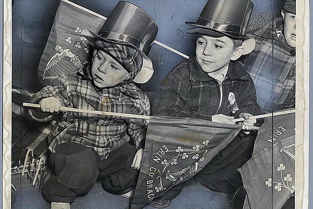 Here, two Brooklyn kids got up early to get a good seat along the parade route in 1951.