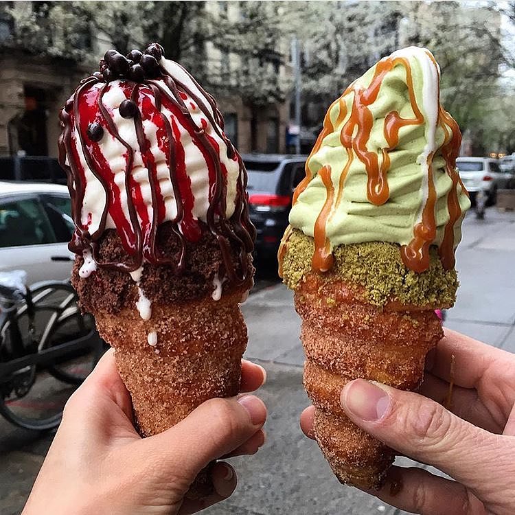 coneCHURRO!® NYC! 1:30pm - midnight, daily.  Lookout for additional MAY FLAVORS!! *Banana Brûlée *Strawberry Shortcake, *Nutella S'mores Galore!!! Pictured: choco raspberry, green tea sea salt caramel. Photo cred: feedyourgirlfriend.
JHERI CURL - sea salt caramel coated inner cone, cinnamon struessel rim with sea salt caramel drizzle.

NUTTY PROFESSOR:  nutella smeared "inner" cone with brown sugar pecan rim, world's tastiest tahitian vanilla bean soft serve with toasted almonds, nutella drizzle and frosted pecan top.

TWINKLE SPRINKLES:  66% Valrhona caribe chocolate ganache coated inner cone with happy dance rainbow sprinkles.

POINDEXTER:  66% Valrhona caribe chocolate ganache coated inner cone with happy dance rainbow sprinkled RIM.

CHOCO-RASPBERRY SUNDAE:  chocolate ganache/raspberry jam filling, chocolate struessel rim, raspberry and chocolate sauce drizzle. 
GREEN ENVY:  red bean inner cone, green tea struessel rim, green tea/vanilla swirl, red bean top. 
204 E. 10th st. @2nd Ave., NYC, BITCHESSSZz.  conechurro.com