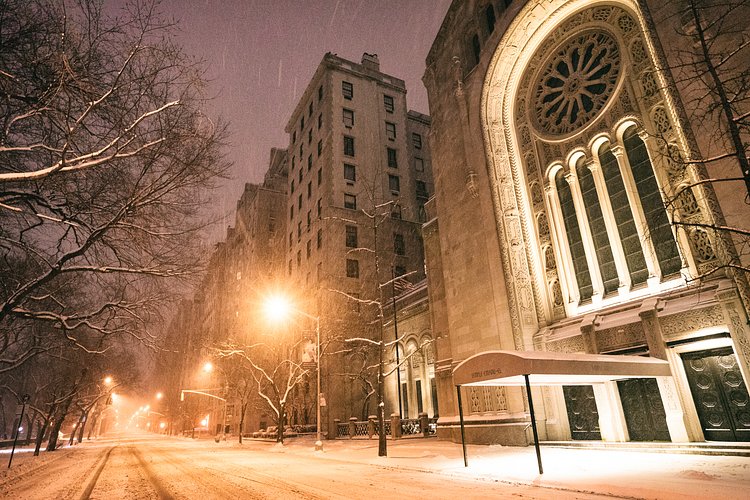 New York City - Snow - Winter Storm Juno - Empty 5th Avenue - Temple Emanu-el | Juno: The first snowstorm of 2015 in New York City.

---

(Note: My <a href="http://www.amazon.com/gp/product/1440339589/ref=as_li_tl?ie=UTF8&amp;camp=1789&amp;creative=9325&amp;creativeASIN=1440339589&amp;linkCode=as2&amp;tag=nyththle0e-20&amp;linkId=ER6GYT5FRYNMEPLF" rel="nofollow">New York photography book</a> released worldwide in stores/online recently and has photos similar to this  [full info below])

---

I have been photographing New York City during snowstorms at night for the past 5 years. When it comes to experiencing <a href="http://nythroughthelens.com/tagged/snow" rel="nofollow">New York City in the snow</a>, I relish the challenge. The more gusty, snowy, and brutal the storm, the more of a chance that I will be out in it traipsing around New York City with my cameras in tow.

When I heard that the MTA was suspending all transit service (and most vehicles) at 11 pm, I made the decision to take the train up to the Upper East Side prior to 11 pm to deposit myself up there with the intention of walking from the Upper East Side to Times Square and then walking the several miles back to the Lower East Side (whew!!).

The streets were eerily empty.

Emptier than they are usually at night during snowfall. Since there was a ban on all vehicles aside from snow plows and emergency services, there were practically no cars at all on the streets. Even taxis were banned from the streets!

I walked in the middle of avenues and streets that are usually teeming with cars.

There was an eerie sense of calm.

It was magical.


---

This is part of a post that I posted to my NYC photography blog. If you are curious enough to look at the photos there, here is the link to the post:

<a href="http://nythroughthelens.com/post/109291619025/new-york-city-snow-winter-storm-juno-i" rel="nofollow">New York City - Winter Storm Juno</a>


----

* As mentioned above - My New York City coffee table book that released in stores/online worldwide recently.

 Tons of information about my <a href="http://www.amazon.com/gp/product/1440339589/ref=as_li_tl?ie=UTF8&amp;camp=1789&amp;creative=9325&amp;creativeASIN=1440339589&amp;linkCode=as2&amp;tag=nyththle0e-20&amp;linkId=ER6GYT5FRYNMEPLF" rel="nofollow">New York photography book</a> with sample pages (including where to order and what stores are carrying it) here:

<a href="http://nythroughthelens.com/post/92873566010/ny-through-the-lens-the-book-i-am-super" rel="nofollow">NY Through The Lens: A New York Coffee Table Book</a>
---


View my New York City photography at my website <a href="http://nythroughthelens.com/" rel="nofollow">NY Through The Lens</a>.

View my Travel photography at my travel blog: <a href="http://travelinglens.me/" rel="nofollow">Traveling Lens</a>.

Interested in my work and have questions about PR and media? Check out my:

<a href="http://nythroughthelens.com/about" rel="nofollow">About Page</a> | <a href="http://nythroughthelens.com/PR" rel="nofollow">PR Page</a> | <a href="http://nythroughthelens.com/media" rel="nofollow">Media Page</a>