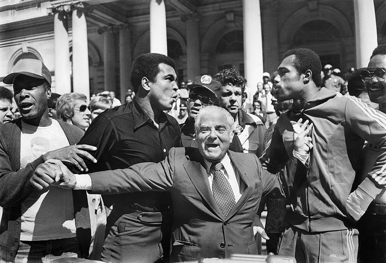 Sept. 13, 1976: Feathers ruffled, chests puffed out, Muhammad Ali, left, and Ken Norton, right, talked tough for the benefit of the media on the steps of City Hall (photo Page 47 of this paper). Fortunately, Mayor Beame was on hand to keep the peace. The peace ended, according to schedule, on Sept. 28 when Ali beat Norton and retained the world heavyweight championship, though not without controversy. “I thought I won it,” Norton said later. “Ali knew I won it. The people knew I won it.”