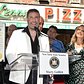 John Travolta is honored at Lenny's Pizza in Brooklyn on John Travolta Day.