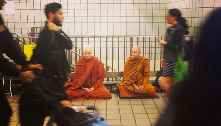 Meditating in a New York subway station.
