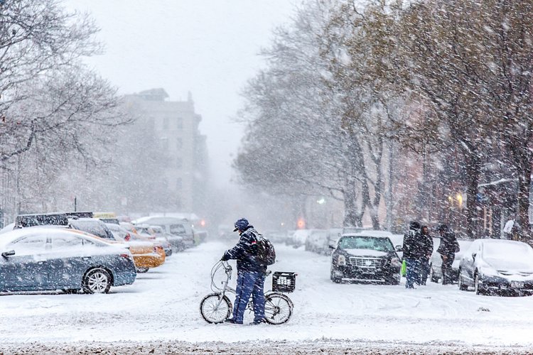 Delivery Rider Pushing a Bike Through Snow on First Avenue, New York, NY, 2015