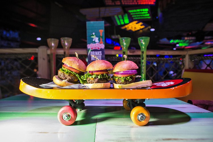Founded in Mexico in 1969, Señor Frog’s thrives in Caribbean beach towns and caters to college students on spring break who will fake orgasms on stage to win free margaritas. Here, cheeseburger sliders.