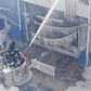 Firefighters continued pouring water on the remains of a 7-alarm fire in a warehouse on the Williamsburg waterfront