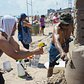 Spray | 8/20/2016 Sculptors wetting the sand at the Coney Island Sand Sculpting Contest. Sony a7. Carl Zeiss Planar 45mm 1:2.0.