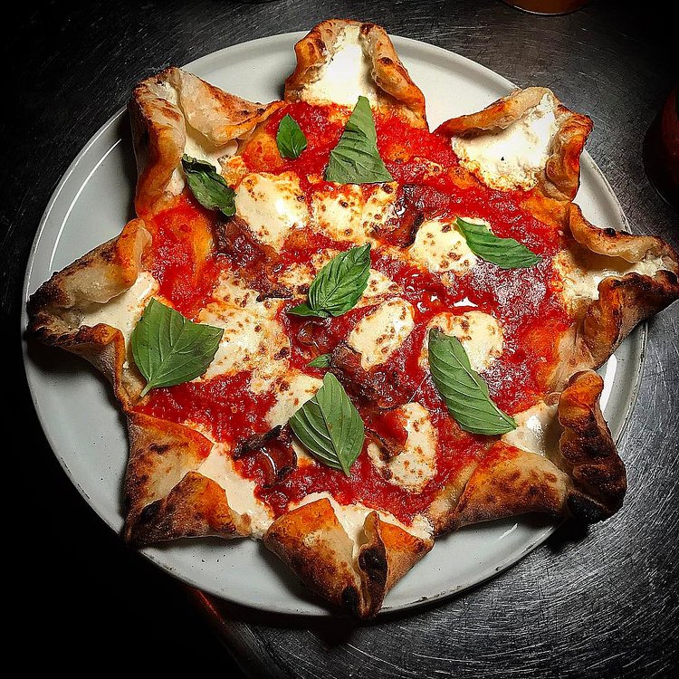 It's #pizzahappyhour! Tuesday - Friday from 6-8 get ANY of our pizzas AND a glass of wine or draft beer for just $15. Here's our stuffed crust margherita with crispy guanciale. Only available during happy hour! #21greenpoint #11222