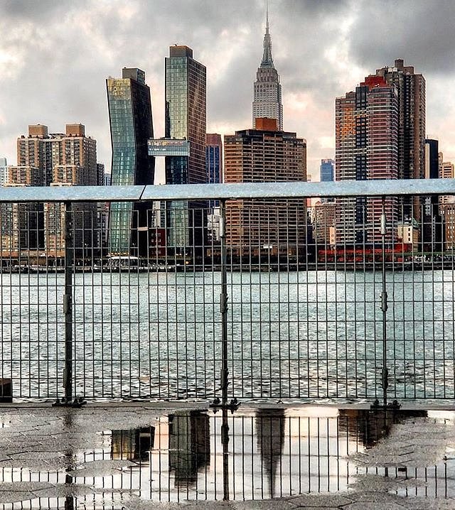 New York, New York. Photo via @qwqw7575 #viewingnyc #newyorkcity #newyork #nyc #eastriver #skyline #reflection #empirestatebuilding #americancopperbuildings