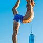 Performing yoga with the One World Trade Center in New York as a backdrop