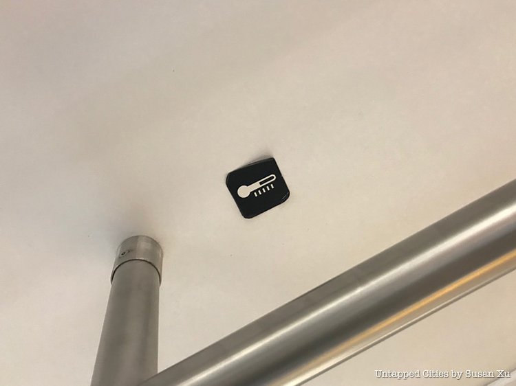 Thermometer Stickers on NYC Subway Ceilings