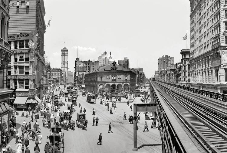 New York circa 1908. "Herald Square." Panorama composed of two 8x10 inch glass negatives, digitally merged, showing Broadway at 34th Street. Landmarks include the New York Herald newspaper building (with its clockwork blacksmith bell-ringers and electrified owls), Sixth Avenue elevated tracks, New York Times building and Hotel Astor. Detroit Publishing Co.