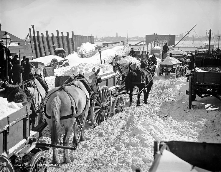 Snow carts at the river after a blizzard, New York, 1899.