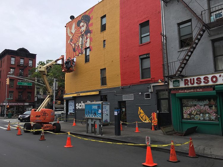 The wind is a pain, but Shep and Nic are troopers...@obeygiant again. #shepardfairey x #thelisaprojectnyc #nyc #littleitaly #littlelittleitaly #obey #obeygiant #nyc #mural #muralart