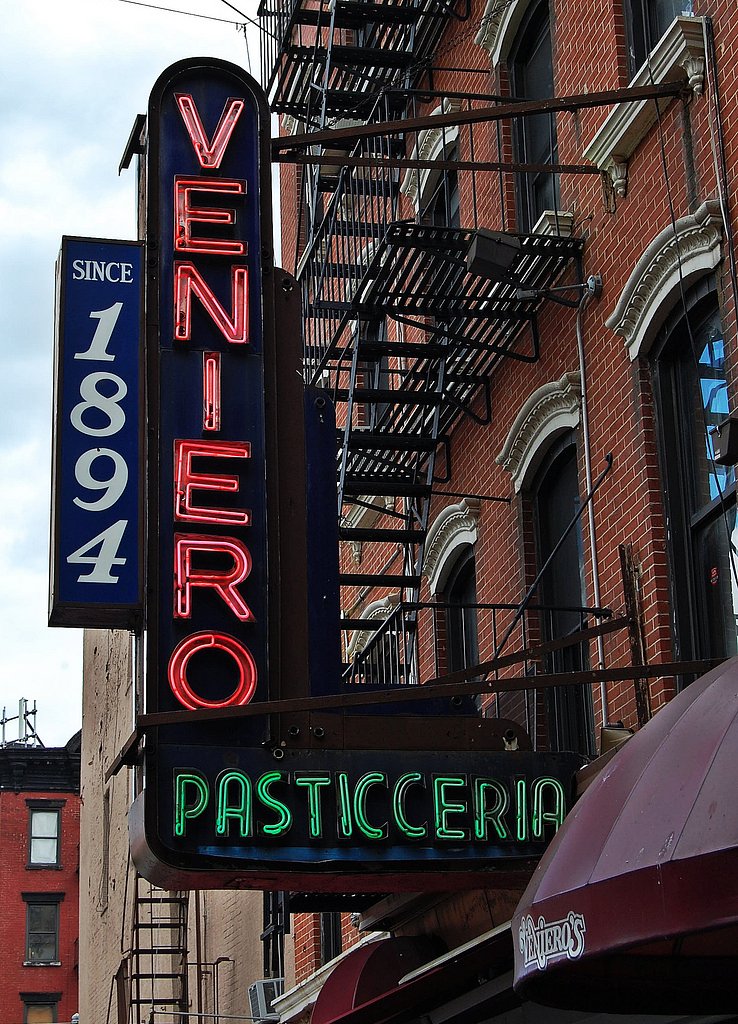 East Village immigration 2/3- 1894 - Veniero's | These three pictures were taken within one avenue block of the East Village and reflect the amazing change this neighborhood, city, and country have experienced in the last 4 generations or so.  

11th Street near 1st Avenue, East Village, NYC

The venerable Veniero Pasticceria has been run at this location by the Veniero family since 1894.  The neighborhood at that time would still have been very much "Kleindeutschland" and home to the 3rd largest German-speaking population on Earth.  In the early 1900's, the Germans moved north, a move partially accelerated by the shattering General Slocum disaster.  By the 1910's, this part of the neighborhood became an Italian enclave.  I know someone whose Sicilian grandparents lived from 1910 to the 1930's on the block across from here.

September 10, 2010
