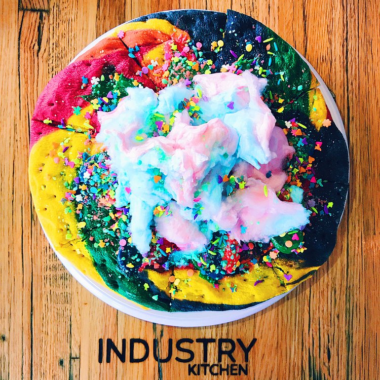 Unicorn pizza exists and it's basically a giant sugar cookie covered in fluffy cotton candy ✨🍕🦄 #cosmobites