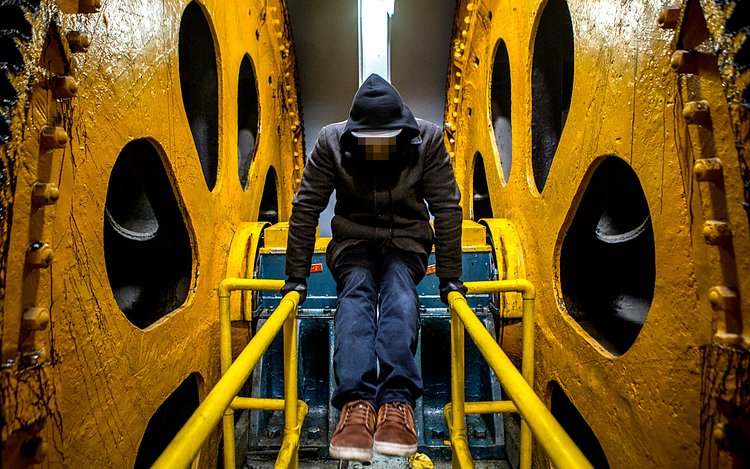 Balancing between the two massive pulleys.