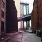 A view of the Manhattan Bridge from Brooklyn, with the view from 1970 on the left and today's view on the right.