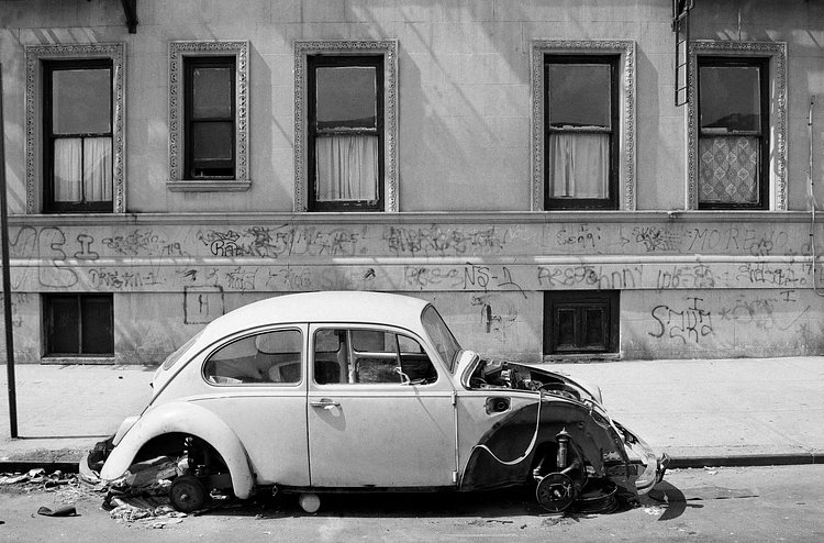 An abandoned Volkswagen on 109th Street between Central Park West and Manhattan Avenue. July 14, 1981.
