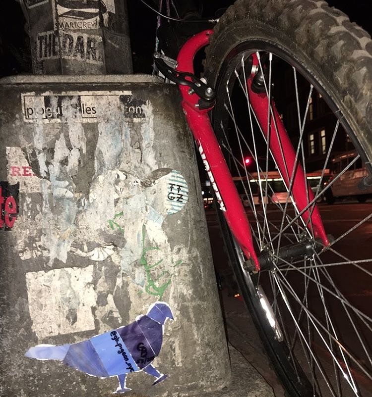 Pigeon 53 - 1st Ave between St. Marks Pl and 9th St. #pigeon #eastvillage #nyc #streetlight #streetart #thestreetsofnyc #original #glass #mosaic #bird #nycstreetart #purple #stainedglass #graffiti #streetlightpigeon #gbpigeonnyc #gbwashere
