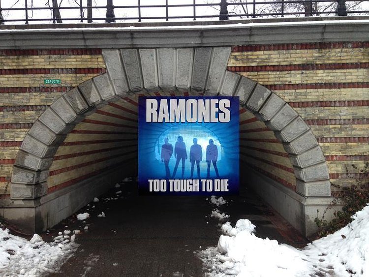 TOO TOUGH TO DIE by THE RAMONES (1984, Sire). . .Photo by George DuBose. . .Location: underneath Playmates Arch, next to the Carousel in Manhattan's Central Park  (near where Center Drive meets the 65th St. Traverse). . .The album was the Ramones eighth studio album and the first to feature Richie Ramone on drums. . .According to Wikipedia: "The photograph on the album cover, which features silhouettes of the band members, resulted from a "lucky accident" after photographer George DuBose's camera malfunctioned" . . .Click the following link to be taken inside Playmates Arch tunnel, with its distinctive yellow-and-red brick stripes, via Google Street Views: http://bit.ly/2bIjvKE
