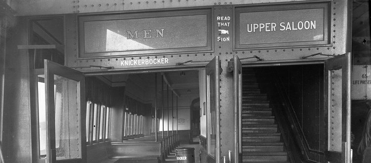 The doors to the men's cabin on the main deck of the ferry boat Knickerbocker. (From the Collection of the Staten Island Museum)