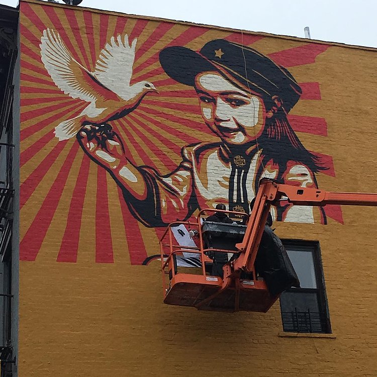 Spotted: A new #OBEY painting going up in the Lower. Trying to see if #shepardfairey is behind the brush... #NYC #Murals #artsyfartsy