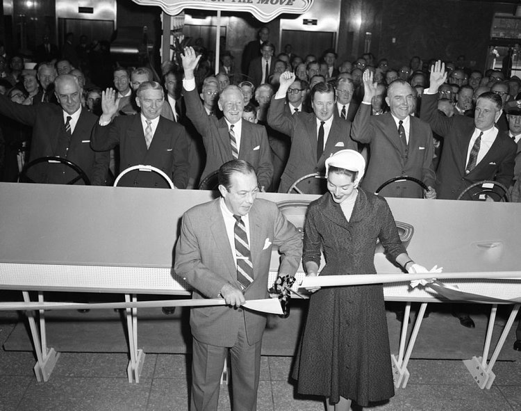 The ribbon is cut, let the show begin! New York Mayor, Robert Wagner, gets a little help from Lee Ann Meriwether, a former Miss America, to help usher in the 1957 auto show.