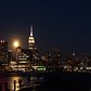 Time-lapse of the Full Harvest Moon passing behind the spire of the Empire State Building​