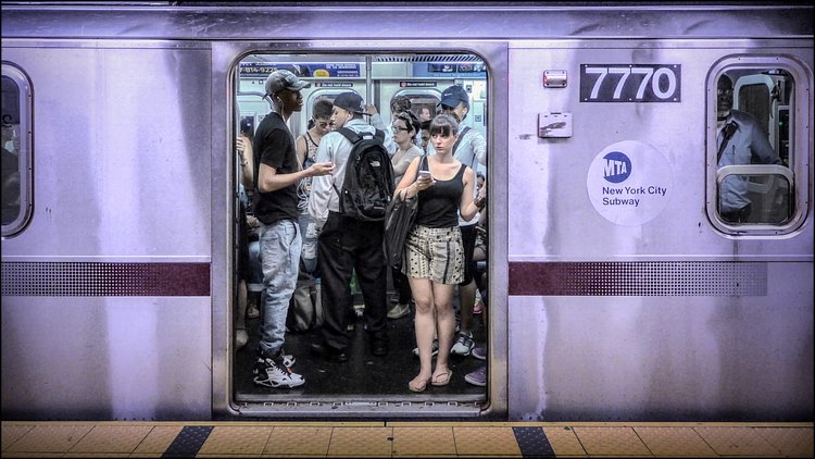 42 Street - Grand Central Station, 4, 5 or 6 Train, Uptown Platform 2014.07.26 | Most people don't see it at first, but the woman in the blue baseball cap (to the right) is actually looking directly into the camera.