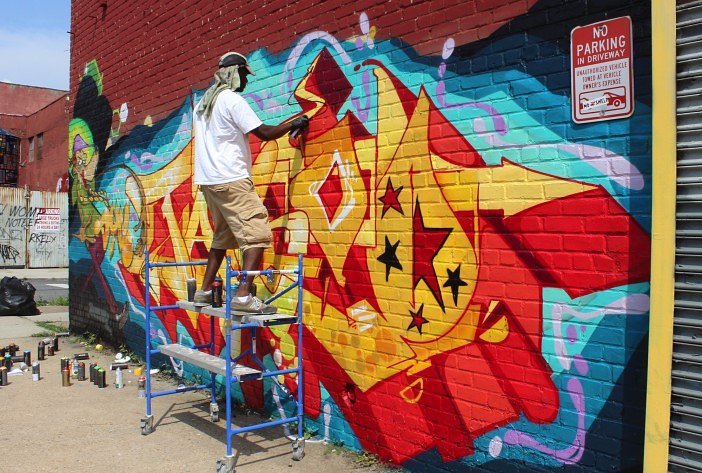 Graffiti artist working on a commissioned piece.