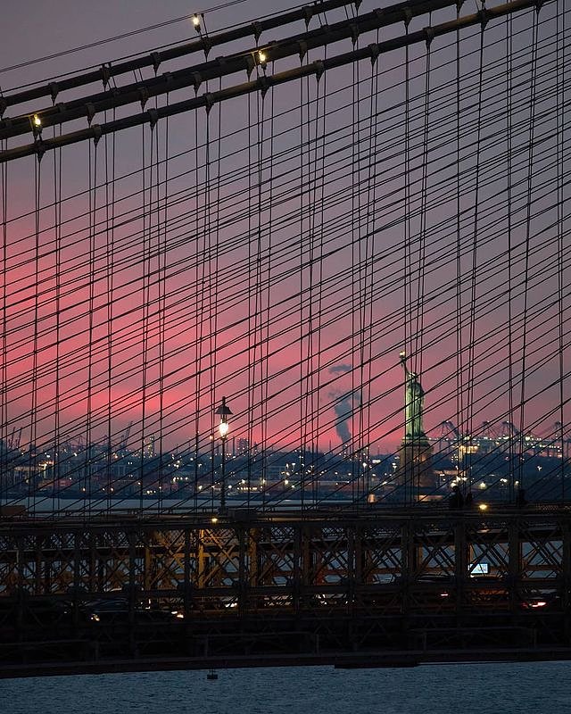 Sunset through the Brooklyn Bridge Cables, New York