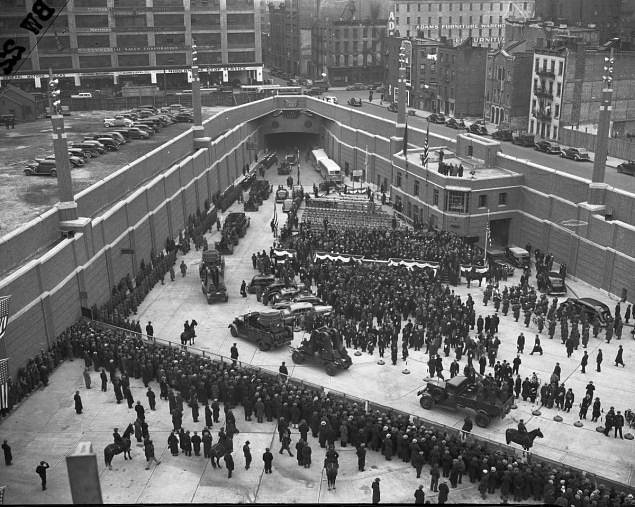 A number of army trucks roll down the ramp into the brand new Lincoln Tunnel.  This view shows the New York entrance, at W. 38th St.