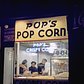 1946 Pop corn vendor in Times Square at night with patrons inside.