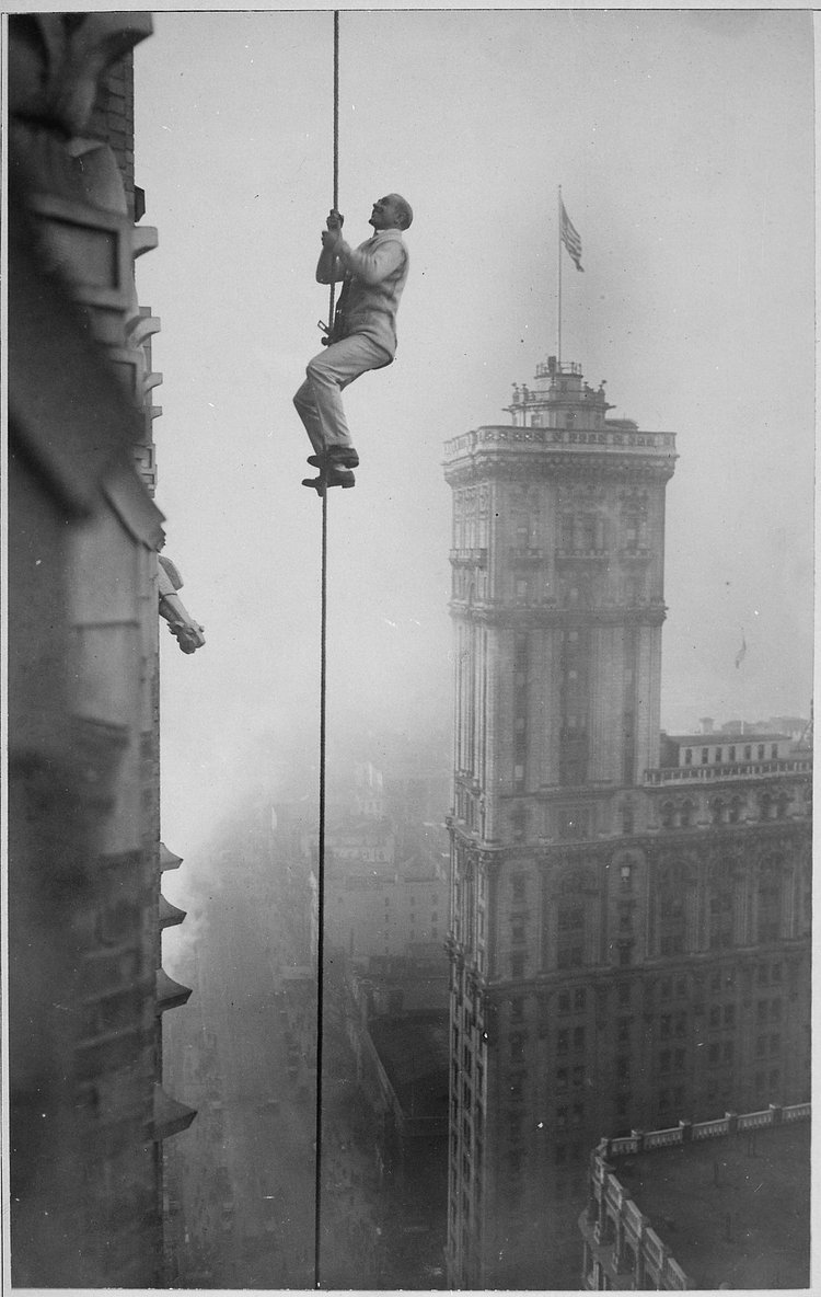 The "Human Squirrel" who did many daring "stunts" in climbing for benefit of War Relief Funds in New York City. | <strong>Original Caption:</strong> The "Human Squirrel" who did many daring "stunts" in climbing for benefit of War Relief Funds in New York City. He is shown here at a dizzy height in Times Square. Times Photo Service., ca. 1918

<strong>U.S. National Archives’ Local Identifier:</strong>165-WW-578B(6)

<strong>From:</strong> American Unofficial Collection of World War I Photographs, compiled 1917 - 1918 (Record Group 165) 

<strong>Created By:</strong> War Department. (1789 - 09/18/1947)

<strong>Production Date:</strong>ca. 1918

<strong>Persistent URL:</strong>  <a href="http://arcweb.archives.gov/arc/action/ExternalIdSearch?id=533754" rel="nofollow">arcweb.archives.gov/arc/action/ExternalIdSearch?id=533754</a>

<strong>Repository: </strong> NARA's Still Picture Records Section, National Archives at College Park (College Park, MD)

 

Access Restrictions: Unrestricted
Use Restrictions: Unrestricted

