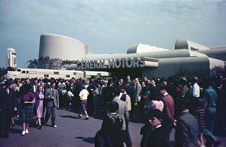A large crowd in front of the General Motors Pavilion.
