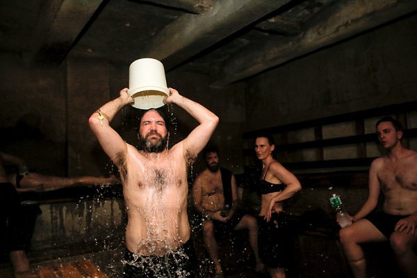 David Abrams cooling off with ice water in a sauna at the Russian and Turkish Baths.