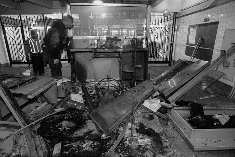 1990's: A firebombed subway token booth at Kingston and Fulton Street lies in ruins following an explosive incident that shook the station in 1995.