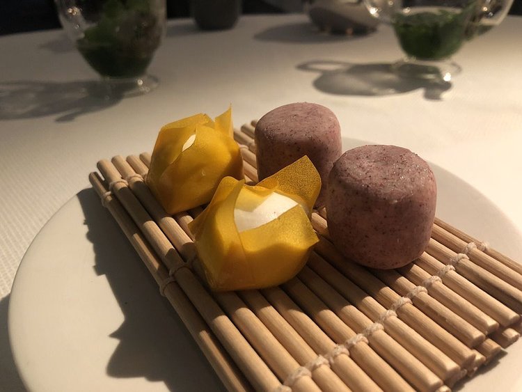 Dessert amuse-bouche. Coconut and mango shumai, blueberry and jasmine ice cream