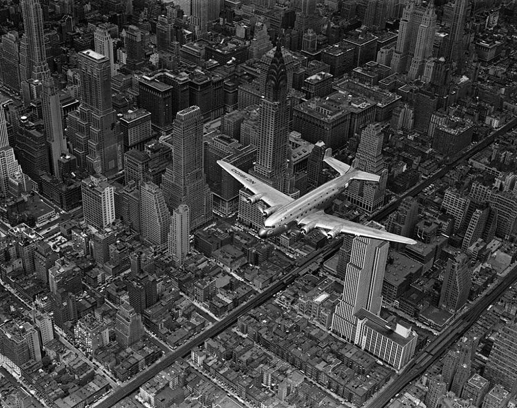 DC-4 flying over New York City, 1939