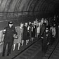 Police officers lead commuters through a subway tunnel where they were trapped during a power failure on Nov. 20, 1965.