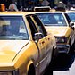 Taxis move through a traffic lane in New York City, 1995