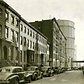 East 20th Street facing east towards 1st Avenue in 1938 with two huge gas holders in the distance.