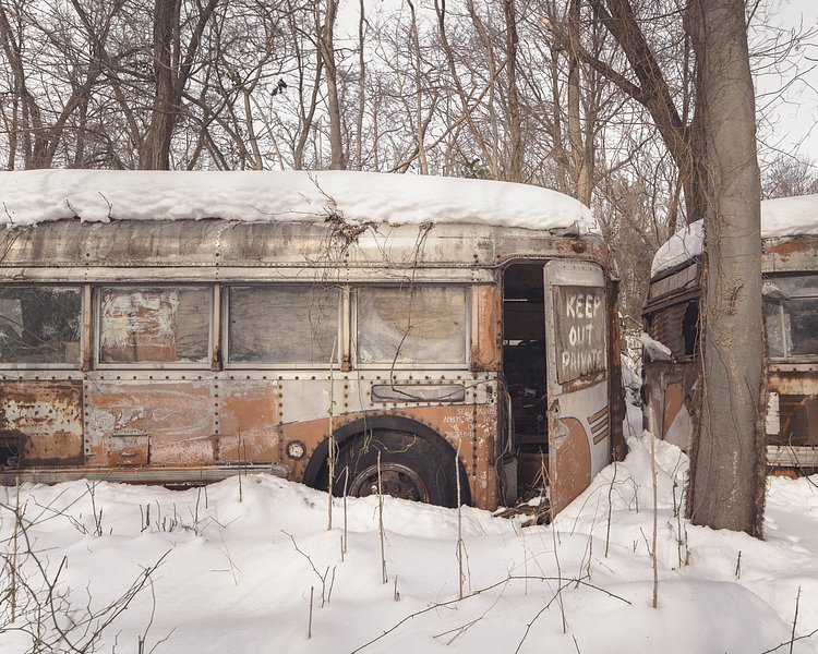 A foot of snow covers a “graveyard” of auto parts…