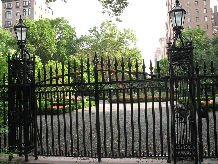 NYC:  Gramercy Park | Gramercy Park (sometimes misspelled as Grammercy) is a small, fenced-in private park bounded by E 20th St, E 21st St, Park Avenue S, and 3rd Avenue, in Gramerce. Normally accessible only to residents of certain townhouses in the area who have keys to the park, nearby residents may buy visiting priviliges and it is open to the public on Christmas Day, Yom Kippur and Gramercy Day (which chanes early, but is often the first Saturday in May). It is the only remaining private park in Manhattan.

The name "Gramercy" is almost certainly a corruption of the Dutch word "krom mesje," or "little crooked knife," the name of a small brook that flowed along what is now 21st Street. The area was originally a swamp when Samuel B. Ruggles bought it from James Duane and turned it into part of Gramercy Farm. In 1831 Ruggles donated the property to the city on condition that no commercial enterprise be permitted on the facing streets or in the park proper. To this day, the park contains no amusements, swing sets, snack shops or any other intrusions on its rusticity.

The center of the park contains a statue of one of the area's most famous residents, Edwin Booth. Booth was one of the great Shakespearean actors of 19th century America, as well as the brother of John Wilkes Booth, the assassin of Abraham Lincoln.
