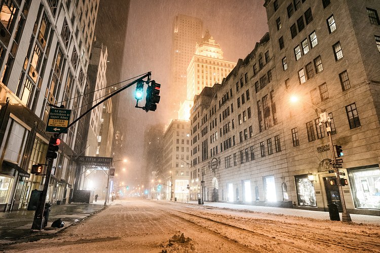New York City - Snow - Winter Storm Juno - Empty 5th Avenue - Bergdorf | Juno: The first snowstorm of 2015 in New York City.

---

(Note: My <a href="http://www.amazon.com/gp/product/1440339589/ref=as_li_tl?ie=UTF8&amp;camp=1789&amp;creative=9325&amp;creativeASIN=1440339589&amp;linkCode=as2&amp;tag=nyththle0e-20&amp;linkId=ER6GYT5FRYNMEPLF" rel="nofollow">New York photography book</a> released worldwide in stores/online recently and has photos similar to this  [full info below])

---

I have been photographing New York City during snowstorms at night for the past 5 years. When it comes to experiencing <a href="http://nythroughthelens.com/tagged/snow" rel="nofollow">New York City in the snow</a>, I relish the challenge. The more gusty, snowy, and brutal the storm, the more of a chance that I will be out in it traipsing around New York City with my cameras in tow.

When I heard that the MTA was suspending all transit service (and most vehicles) at 11 pm, I made the decision to take the train up to the Upper East Side prior to 11 pm to deposit myself up there with the intention of walking from the Upper East Side to Times Square and then walking the several miles back to the Lower East Side (whew!!).

The streets were eerily empty.

Emptier than they are usually at night during snowfall. Since there was a ban on all vehicles aside from snow plows and emergency services, there were practically no cars at all on the streets. Even taxis were banned from the streets!

I walked in the middle of avenues and streets that are usually teeming with cars.

There was an eerie sense of calm.

It was magical.


---

This is part of a post that I posted to my NYC photography blog. If you are curious enough to look at the photos there, here is the link to the post:

<a href="http://nythroughthelens.com/post/109291619025/new-york-city-snow-winter-storm-juno-i" rel="nofollow">New York City - Winter Storm Juno</a>


----

* As mentioned above - My New York City coffee table book that released in stores/online worldwide recently.

 Tons of information about my <a href="http://www.amazon.com/gp/product/1440339589/ref=as_li_tl?ie=UTF8&amp;camp=1789&amp;creative=9325&amp;creativeASIN=1440339589&amp;linkCode=as2&amp;tag=nyththle0e-20&amp;linkId=ER6GYT5FRYNMEPLF" rel="nofollow">New York photography book</a> with sample pages (including where to order and what stores are carrying it) here:

<a href="http://nythroughthelens.com/post/92873566010/ny-through-the-lens-the-book-i-am-super" rel="nofollow">NY Through The Lens: A New York Coffee Table Book</a>
---


View my New York City photography at my website <a href="http://nythroughthelens.com/" rel="nofollow">NY Through The Lens</a>.

View my Travel photography at my travel blog: <a href="http://travelinglens.me/" rel="nofollow">Traveling Lens</a>.

Interested in my work and have questions about PR and media? Check out my:

<a href="http://nythroughthelens.com/about" rel="nofollow">About Page</a> | <a href="http://nythroughthelens.com/PR" rel="nofollow">PR Page</a> | <a href="http://nythroughthelens.com/media" rel="nofollow">Media Page</a>
