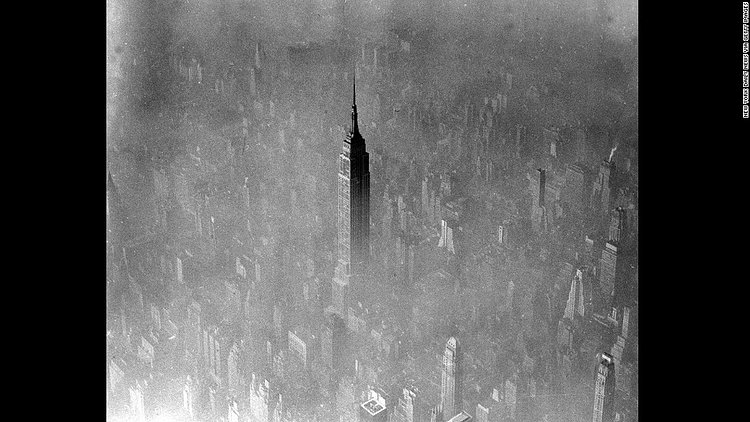 Fog eclipses nearly all of midtown Manhattan except for the 103-story Empire State Building, seen in this 1961 aerial photo. 