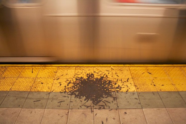 Undisturbed pile of gunk on a NYC subway platform.