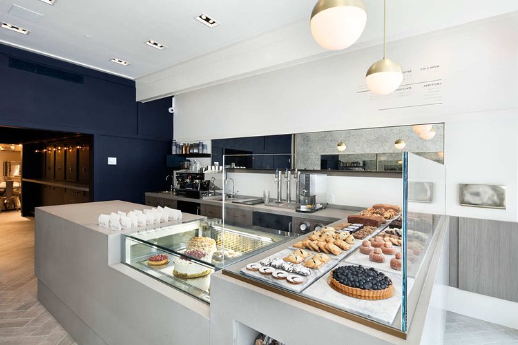 The design is clean and modern, with the pastries at center stage.