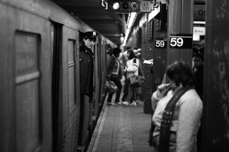 1980's: Police officer Bob Redgrave peers from a car of the N train at the Columbus Circle station on the first night that officers were assigned to each of the 320 subway trains that ran between 8 p.m. and 6 a.m. Operation High Visibility was part of Mayor Koch's plan to bolster security and restore public confidence in subway safety.
